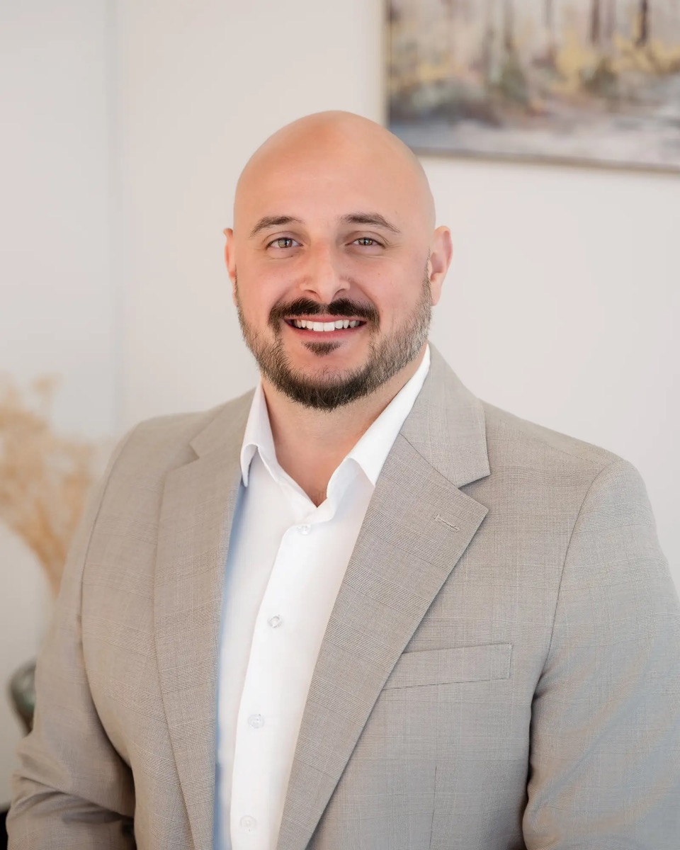Mitch Fields, Chief Technology Officer of Century 21 Results, in a light grey suit